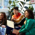 Business women talking to male colleague, informal meeting