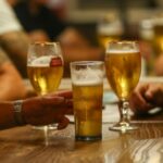 Customers drinking beer at The Moon Under Water pub in London