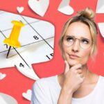 Women thinking in front of a calendar with a background of hearts