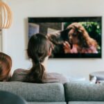 Image of two people watching TV together