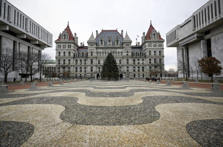 The state's budget is nearly three weeks late, and a stopgap spending bill could keep lawmakers in Albany. But there is no indication Gov. Kathy Hochul will actually do it yet.