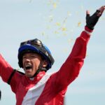 Frankie Dettori celebrates atop Inspiral after winning the Breeders' Cup Filly and Mare Turf