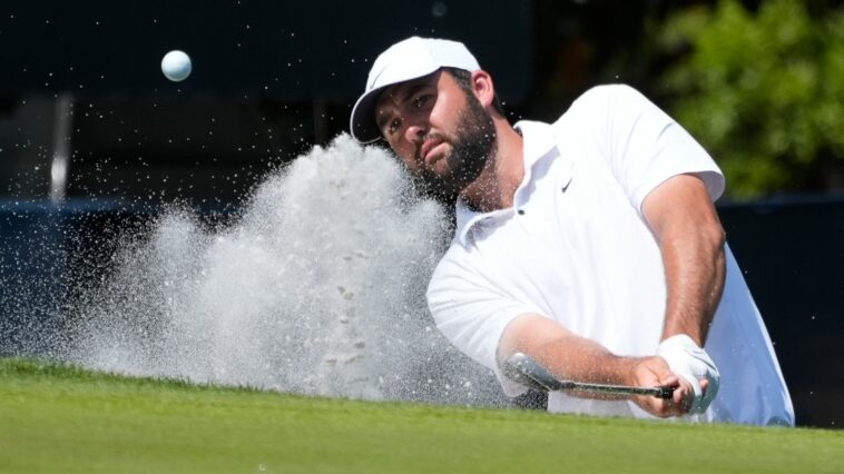 FILE - Scottie Scheffler hits out of the sand on the second green during the final round of The Players Championship golf tournament Sunday, March 17, 2024, in Ponte Vedra Beach, Fla. (AP Photo/Marta Lavandier, File)