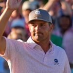 Bryson DeChambeau celebrates after chipping in for a birdie on the 18th hole during third round at the Masters golf tournament at Augusta National Golf Club Saturday, April 13, 2024, in Augusta, Ga. (AP Photo/Ashley Landis)