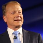 AI will power the stock market for the next decade, former Cisco CEO says