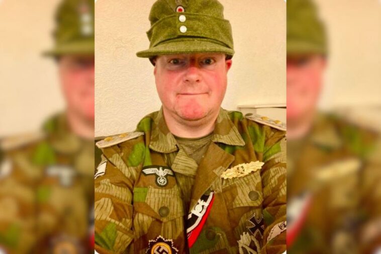 Councillor says wearing uniform with Nazi symbols was 'bad choice'