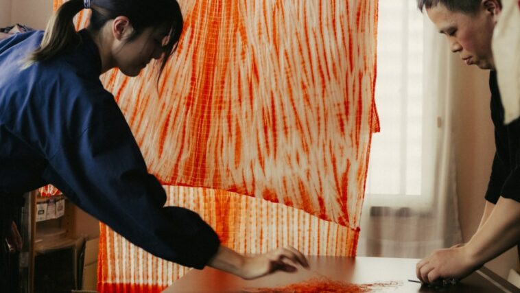 Shibori artisan Kazuki Tabata, right, is collaborating with Cos on a summer capsule.