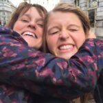 Marie Devereux cuddling daughter Natalie in the street