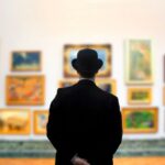 Man wearing Bowler hat in gallery