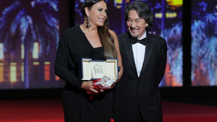 Karla Sofía Gascón with Hirokazu Kore-eda Emilia Perez Cannes.