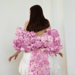 The designer models her crop top made of real peonies.