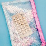 Birth control pills inside a handbag