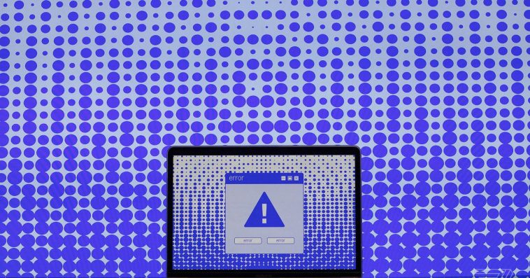 Illustration of a computer screen with a blue exclamation point on it and an error box.