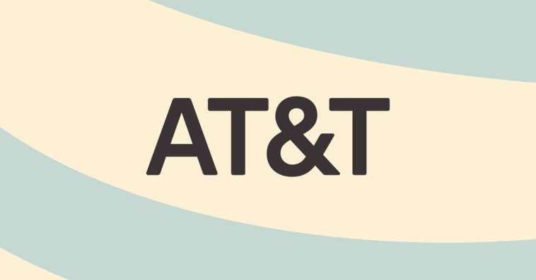 The text AT&amp;T logo on a light blue and tan background