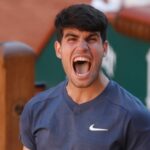 Spain's Carlos Alcaraz celebrates as he won the semifinal match of the French Open tennis tournament against Italy's Jannik Sinner at the Roland Garros stadium in Paris, Friday, June 7, 2024. (AP Photo/Jean-Francois Badias)