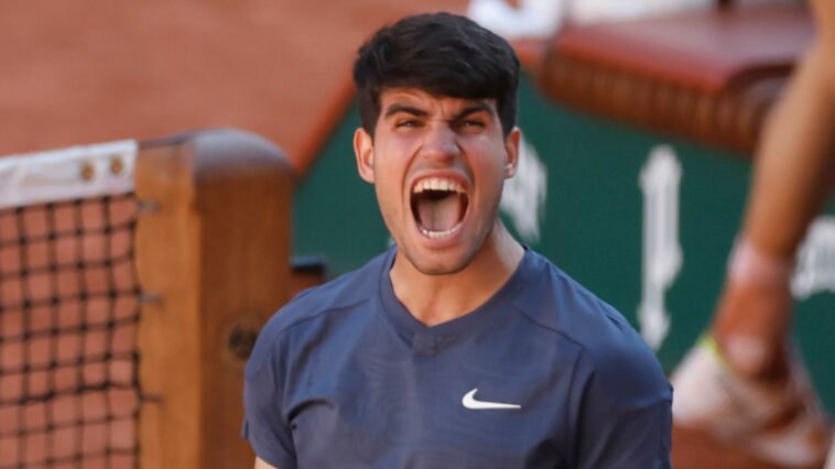 Spain's Carlos Alcaraz celebrates as he won the semifinal match of the French Open tennis tournament against Italy's Jannik Sinner at the Roland Garros stadium in Paris, Friday, June 7, 2024. (AP Photo/Jean-Francois Badias)