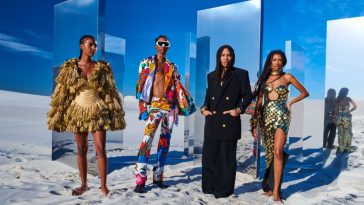 Designer Olivier Rousteing poses with models in the Disney x Balmain: The Lion King collection.