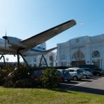 CN0911 An aircraft spanning the entrance to Airport House, the original terminal building for the old Croydon Airport.