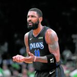 Dallas Mavericks guard Kyrie Irving (11) reacts in the third quarter against the Boston Celtics during game one of the 2024 NBA Finals at TD Garden. Mandatory Credit: David Butler II-USA TODAY Sports