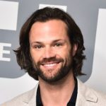 Jared Padalecki in front of The CW red carpet