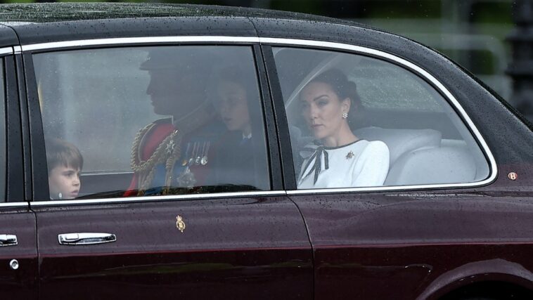 Britain's Catherine, Princess of Wales, (R) arrives with Britain's Prince William, Prince of Wales, (rear C) and their children Britain's Prince George of Wales (C) and Britain's Prince Louis of Wales (L) to Buckingham Palace before the King's Birthday Parade "Trooping the Colour" in London on June 15, 2024. The ceremony of Trooping the Colour is believed to have first been performed during the reign of King Charles II. Since 1748, the Trooping of the Colour has marked the official birthday of the British Sovereign. Over 1500 parading soldiers and almost 300 horses take part in the event. (Photo by HENRY NICHOLLS / AFP) (Photo by HENRY NICHOLLS/AFP via Getty Images)