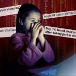 Child scared in front of computer screen with headlines behind her.