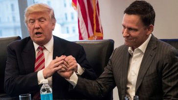 Peter Thiel says, 'If you hold a gun to my head I'll vote for Trump' though he isn't backing campaign