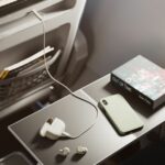 An image of the Jabra Elite 10 Gen 2 connected to an airplane’s in-flight entertainment system.