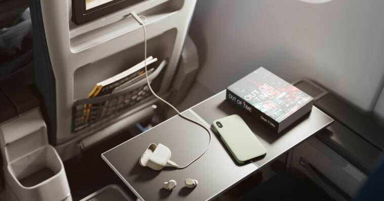 An image of the Jabra Elite 10 Gen 2 connected to an airplane’s in-flight entertainment system.