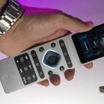 Someone holding Haptique RS90 remote