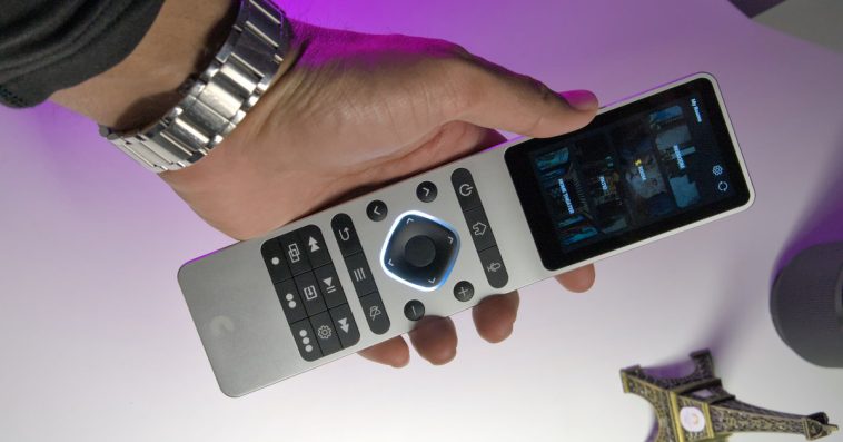 Someone holding Haptique RS90 remote