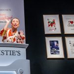 Yu-Ge Wang auctioning The Big Picture playing cards, designed by Vivienne Westwood, at Christie's London.