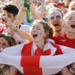 England supporters arrive at an outdoor screen in Hyde Park in central London to watch the 2018 World Cup semi-final between England and Croatia in Moscow on July 11, 2018.