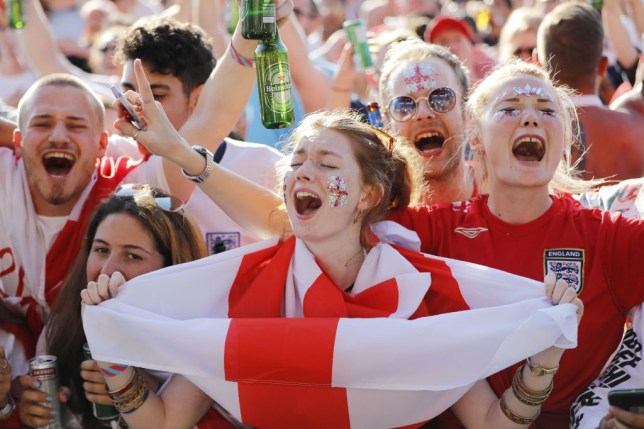 England supporters arrive at an outdoor screen in Hyde Park in central London to watch the 2018 World Cup semi-final between England and Croatia in Moscow on July 11, 2018.