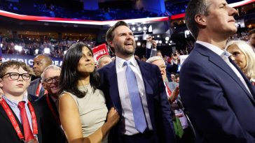 U.S. Sen. J.D. Vance (R-OH) and  his wife Usha Chilukuri Vance look on as he is nominated for the office of Vice President on the first day of the Republican National Convention at the Fiserv Forum on July 15, 2024 in Milwaukee, Wisconsin. Delegates, politicians, and the Republican faithful are in Milwaukee for the annual convention, concluding with former President Donald Trump accepting his party's presidential nomination. The RNC takes place from July 15-18.