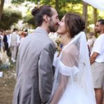 A newlywed couple embracing during their wedding ceremony