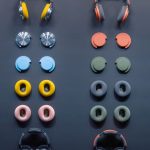 An image showing Dyson’s OnTrac headphones with many different ear cushions and ear cups.