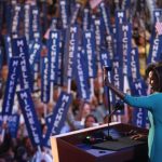 DENVER - AUGUST 25:  Michelle Obama, wife of presumptive Democratic nominee U.S. Sen. Barack Obama (D-IL), waves to the crowd during day one of the Democratic National Convention (DNC) at the Pepsi Center August 25, 2008 in Denver, Colorado. The DNC, where U.S. Sen. Barack Obama (D-IL) will be officially nominated as the Democratic candidate for U.S. president, starts today and finishes August 28th.  (Photo by John Moore/Getty Images)