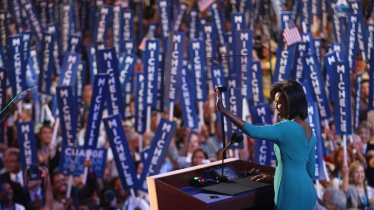 DENVER - AUGUST 25:  Michelle Obama, wife of presumptive Democratic nominee U.S. Sen. Barack Obama (D-IL), waves to the crowd during day one of the Democratic National Convention (DNC) at the Pepsi Center August 25, 2008 in Denver, Colorado. The DNC, where U.S. Sen. Barack Obama (D-IL) will be officially nominated as the Democratic candidate for U.S. president, starts today and finishes August 28th.  (Photo by John Moore/Getty Images)