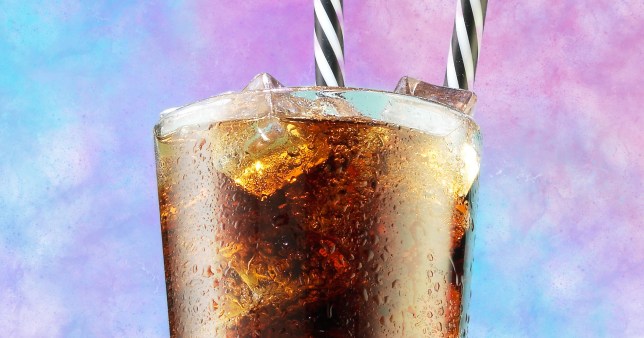 A glass of Coca-Cola on a colourful pink, purple, and blue fluffy background