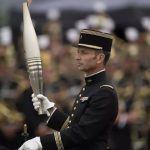 France's Bastille Day parade meets the Olympic torch relay in an exceptional year