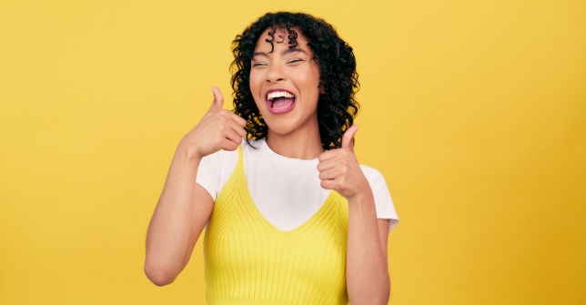 Excited, thumbs up and portrait of woman.