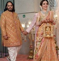 Anant Ambani (L), son of billionaire tycoon and Chairman of Reliance Industries Mukesh Ambani, and his mother Nita Ambani (R) arrive for his wedding ceremony in Mumbai on July 12, 2024. Socialite sisters Kim and Khloe Kardashian were among the global celebrities spotted in India on July 12 to attend a lavish three-day wedding ceremony staged by Asia's richest man Mukesh Ambani. (Photo by SUJIT JAISWAL / AFP) (Photo by SUJIT JAISWAL/AFP via Getty Images)