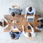 A group of people working on a desk