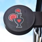 The Nandos logo on a sign