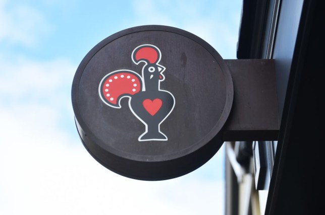 The Nandos logo on a sign