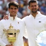 LONDON, ENGLAND - JULY 14: Carlos Alcaraz of Spain poses with the Gentlemen's Singles Trophy alongside Novak Djokovic of Serbia and his Runner-Up Trophy following the Gentlemen's Singles Final during day fourteen of The Championships Wimbledon 2024 at All England Lawn Tennis and Croquet Club on July 14, 2024 in London, England. (Photo by Clive Brunskill/Getty Images)