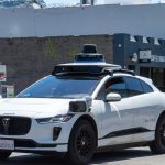 A Waymo car driving on a road in San Francisco.