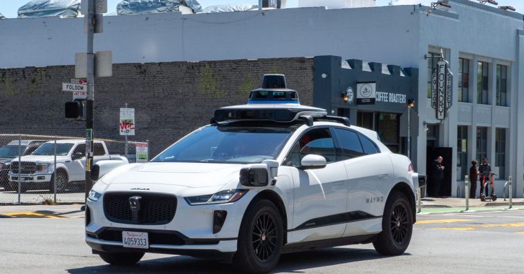 A Waymo car driving on a road in San Francisco.