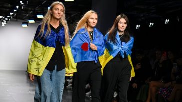 Ksenia Schnaider, Elena Reva and Nadya Dzyak walk the runway with Ukrainian flags at the Ukrainian Fashion Week presents: Ksneniaschnaider, Elenareva, Nadya Dzyak show during London Fashion Week in September 2023